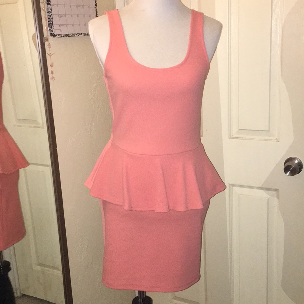 Pink peplum dress.